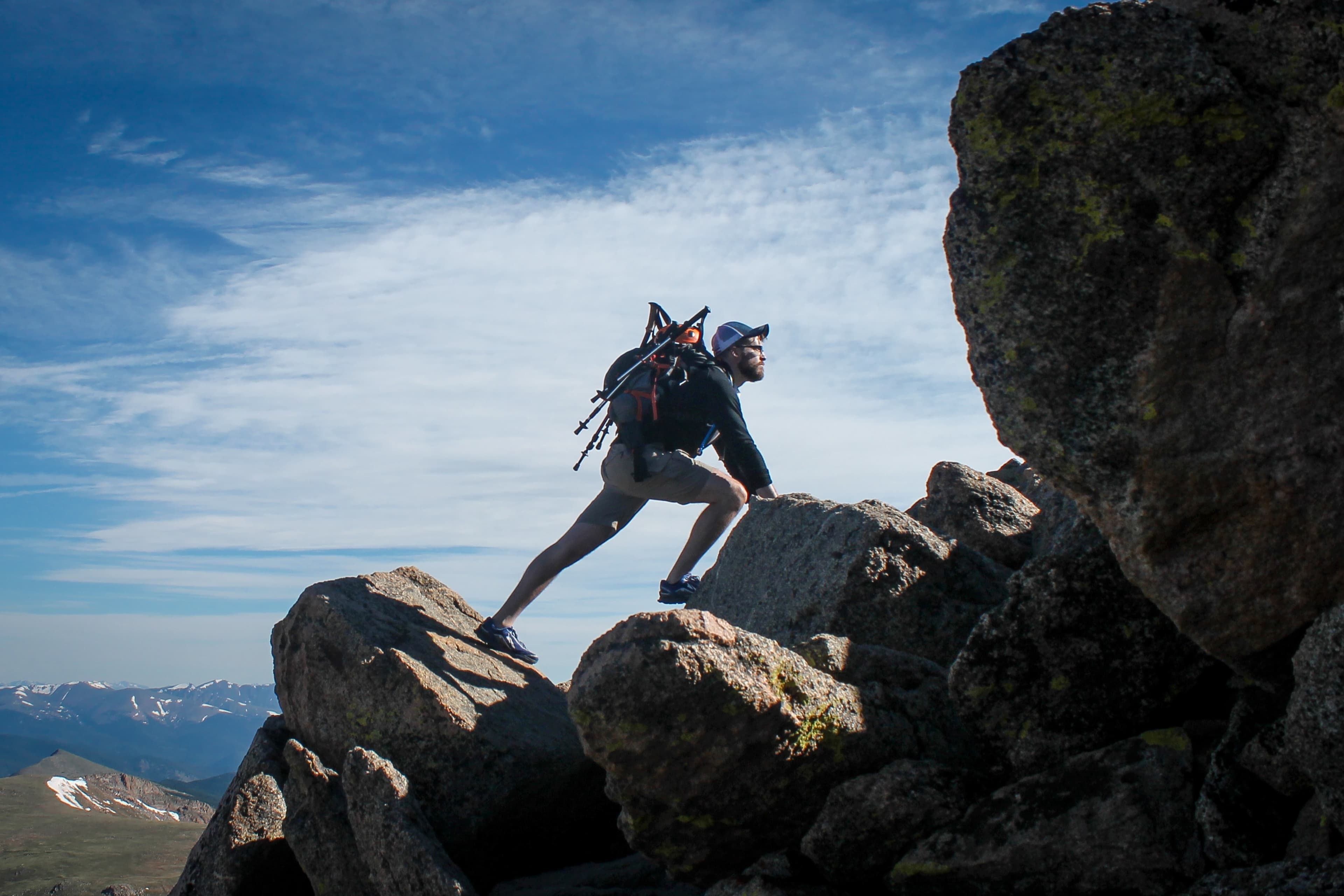 Man scaling a mountain